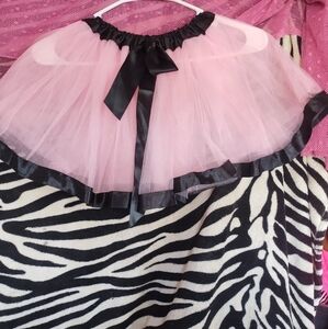 Light pink tutu with black sequin trim on top and bottom